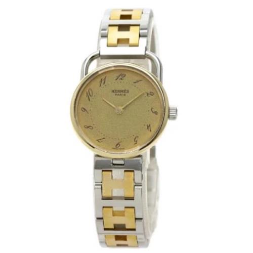 Tweedehands Hermès horloge van roestvrij staal in goud Hermès Vintage ...