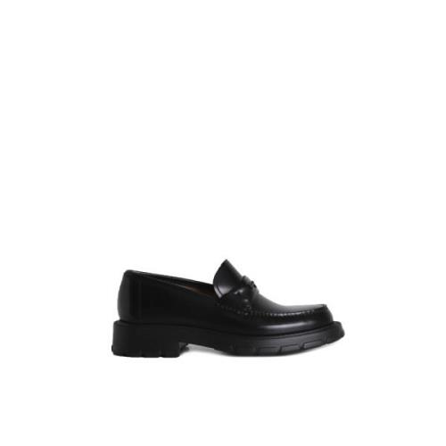 Zwarte platte schoenen met handtekening dwarsbalk Salvatore Ferragamo ...