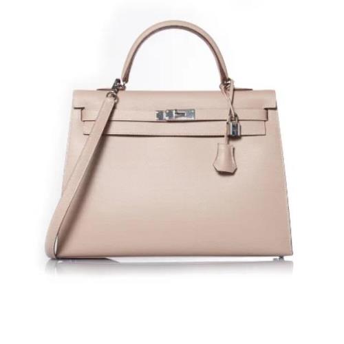 Pre-owned Leather handbags Hermès Vintage , Beige , Dames