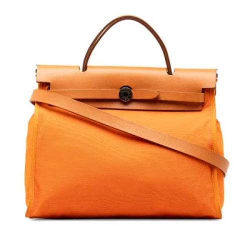 Pre-owned Canvas shoulder-bags Hermès Vintage , Orange , Dames