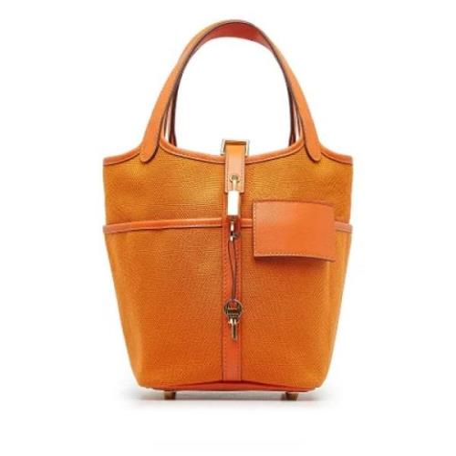 Pre-owned Canvas handbags Hermès Vintage , Orange , Dames