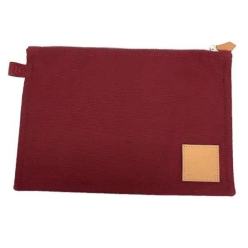 Pre-owned Fabric clutches Hermès Vintage , Red , Dames