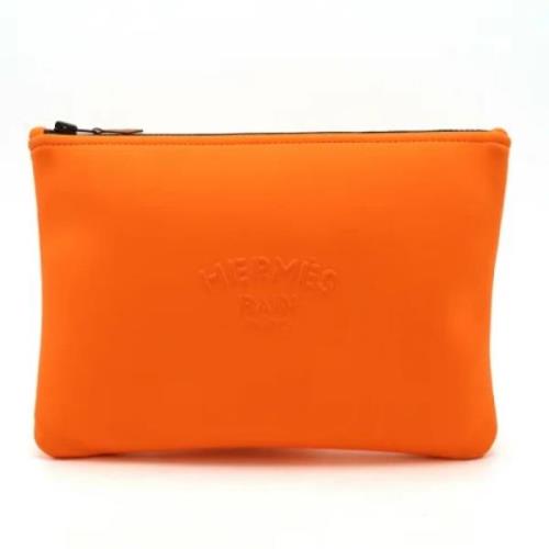 Pre-owned Fabric clutches Hermès Vintage , Orange , Dames