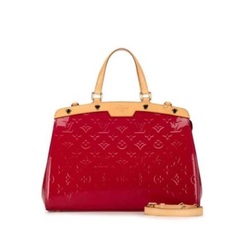 Pre-owned Leather handbags Louis Vuitton Vintage , Red , Dames