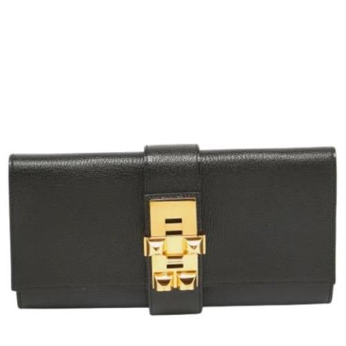 Pre-owned Leather clutches Hermès Vintage , Black , Dames