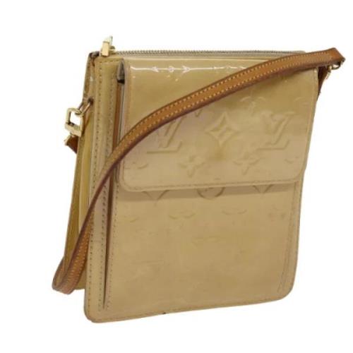 Pre-owned Leather pouches Louis Vuitton Vintage , Beige , Dames