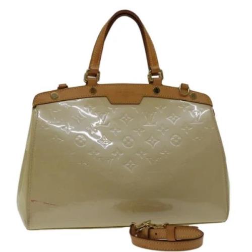 Pre-owned Leather handbags Louis Vuitton Vintage , Beige , Dames