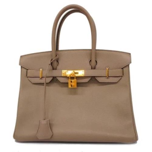 Pre-owned Leather handbags Hermès Vintage , Beige , Dames