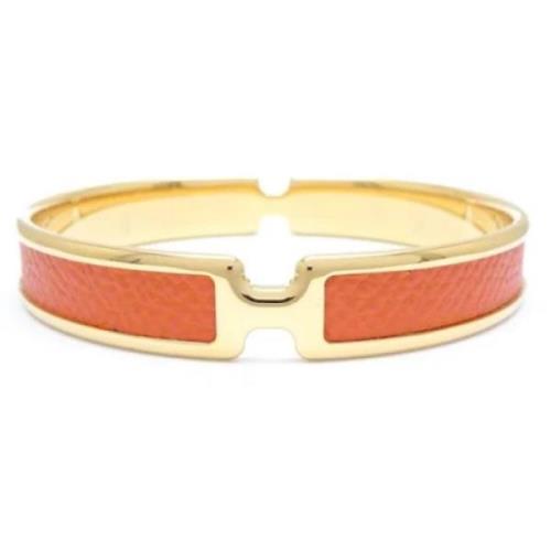 Pre-owned Metal bracelets Hermès Vintage , Orange , Dames