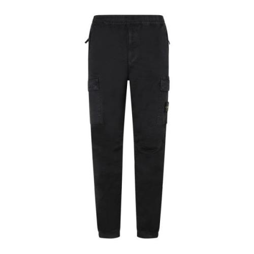 Reguliere Taps Toelopende Broeken in Zwart Stone Island , Black , Here...