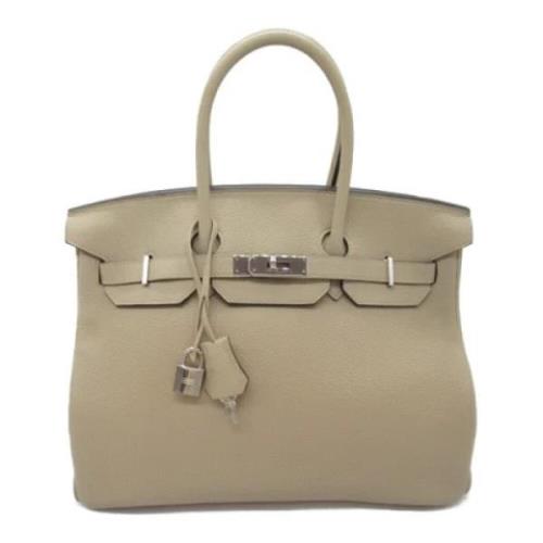 Pre-owned Leather handbags Hermès Vintage , Beige , Dames