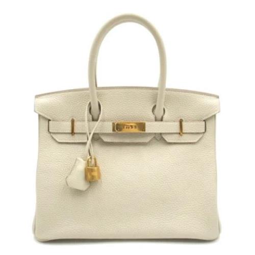 Pre-owned Leather handbags Hermès Vintage , Beige , Dames