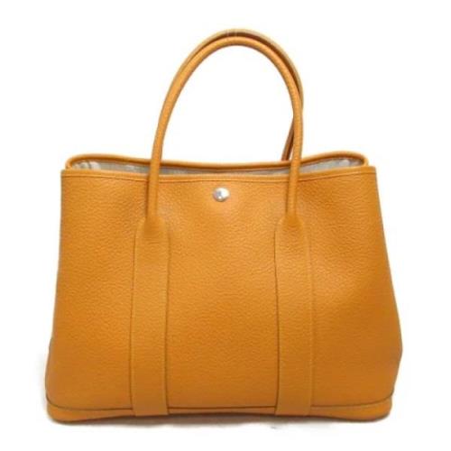 Pre-owned Leather handbags Hermès Vintage , Orange , Dames