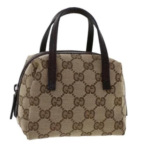 Pre-owned Canvas pouches Gucci Vintage , Beige , Dames