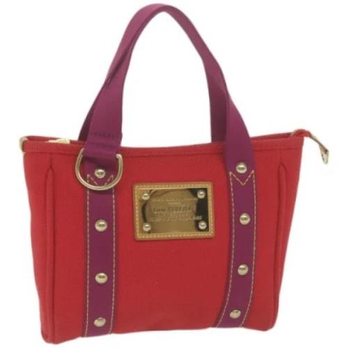 Pre-owned Canvas handbags Louis Vuitton Vintage , Red , Dames