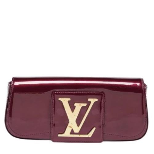 Pre-owned Leather clutches Louis Vuitton Vintage , Red , Dames