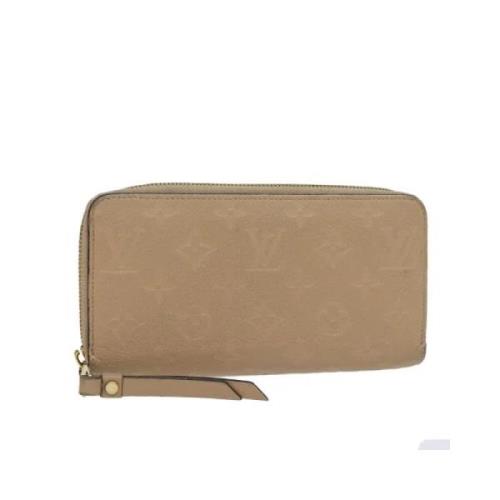 Pre-owned Leather wallets Louis Vuitton Vintage , Beige , Dames