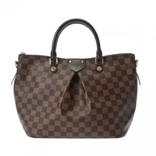 Pre-owned Fabric handbags Louis Vuitton Vintage , Brown , Dames