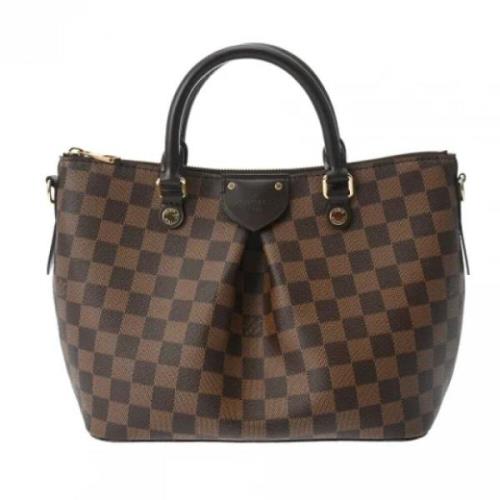 Pre-owned Fabric handbags Louis Vuitton Vintage , Brown , Dames