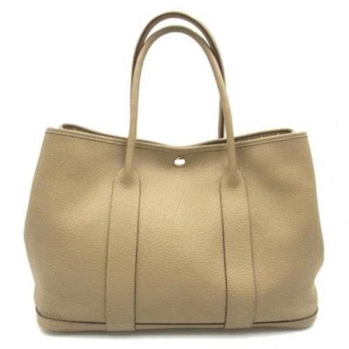 Pre-owned Leather handbags Hermès Vintage , Beige , Dames