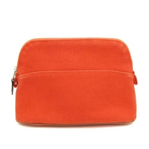 Pre-owned Leather pouches Hermès Vintage , Orange , Dames