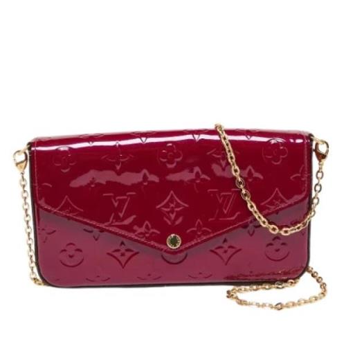 Pre-owned Leather clutches Louis Vuitton Vintage , Red , Dames