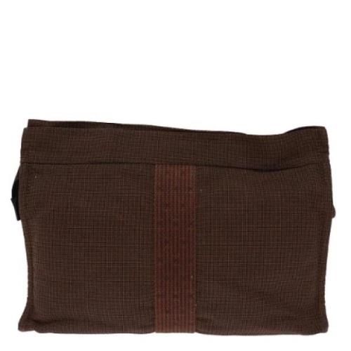 Pre-owned Canvas clutches Hermès Vintage , Brown , Dames