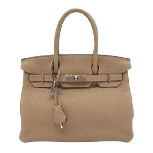 Pre-owned Leather handbags Hermès Vintage , Beige , Dames