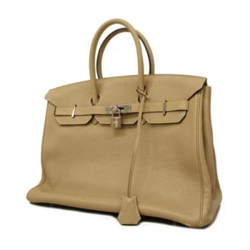 Pre-owned Leather handbags Hermès Vintage , Beige , Dames