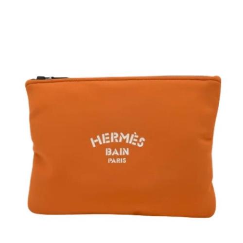 Pre-owned Fabric clutches Hermès Vintage , Orange , Heren