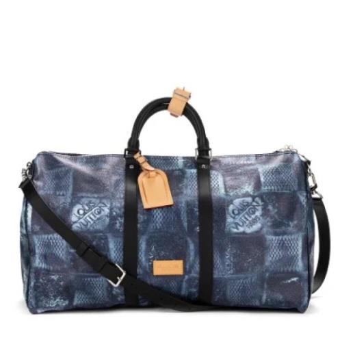 Pre-owned Coated canvas handbags Louis Vuitton Vintage , Blue , Dames