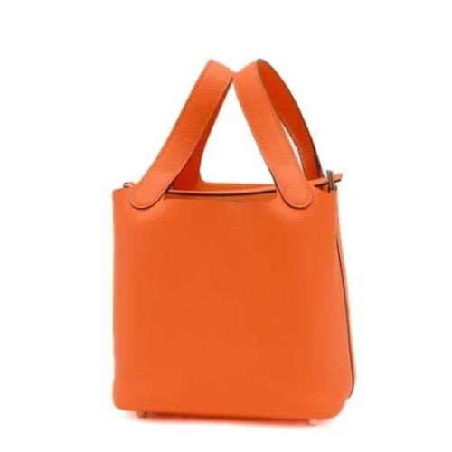 Pre-owned Leather handbags Hermès Vintage , Orange , Dames