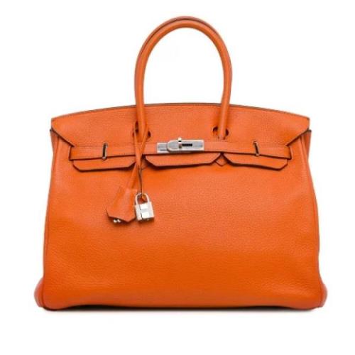 Pre-owned Leather handbags Hermès Vintage , Orange , Dames