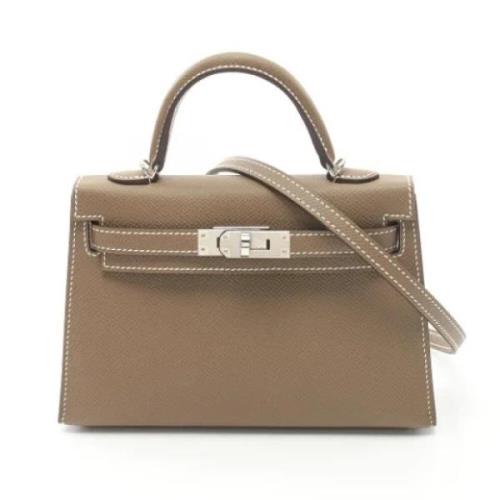 Pre-owned Leather handbags Hermès Vintage , Beige , Dames