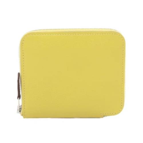 Pre-owned Leather wallets Hermès Vintage , Yellow , Dames