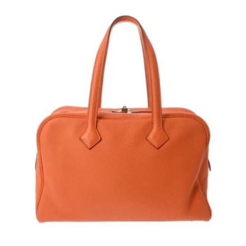 Pre-owned Leather handbags Hermès Vintage , Orange , Dames