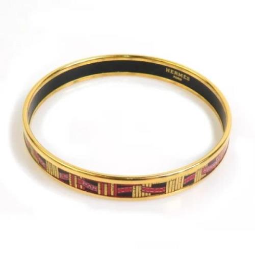 Pre-owned Metal bracelets Hermès Vintage , Yellow , Dames