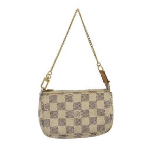 Pre-owned Canvas clutches Louis Vuitton Vintage , Beige , Dames