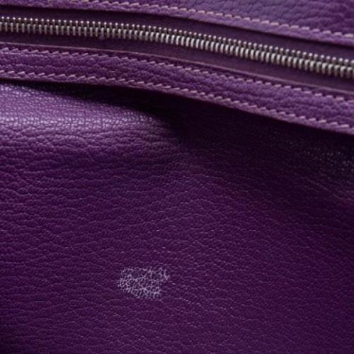 Pre-owned Leather clutches Hermès Vintage , Purple , Dames