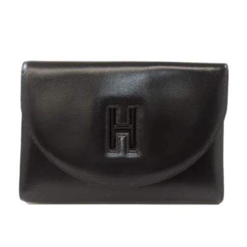 Pre-owned Leather clutches Hermès Vintage , Black , Dames