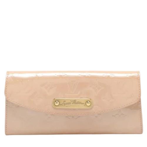 Pre-owned Leather clutches Louis Vuitton Vintage , Beige , Dames