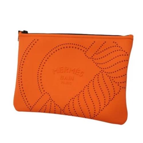 Pre-owned Fabric clutches Hermès Vintage , Orange , Dames