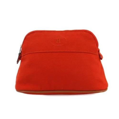 Pre-owned Leather pouches Hermès Vintage , Orange , Dames