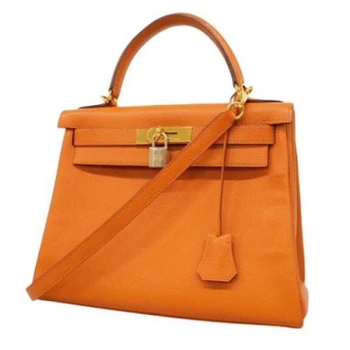 Pre-owned Leather handbags Hermès Vintage , Orange , Dames