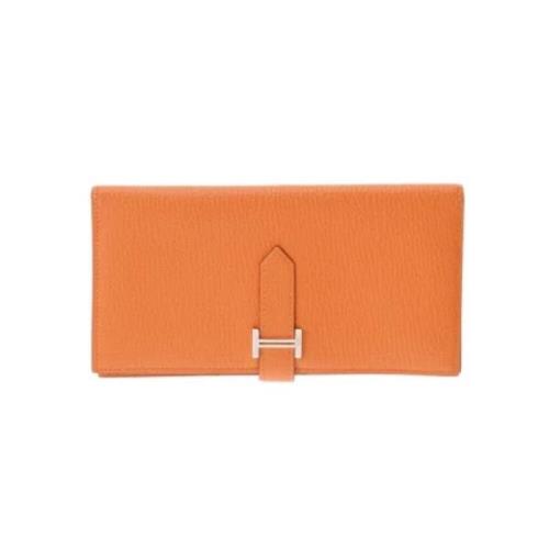 Pre-owned Leather wallets Hermès Vintage , Orange , Dames