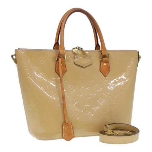 Pre-owned Leather handbags Louis Vuitton Vintage , Beige , Dames