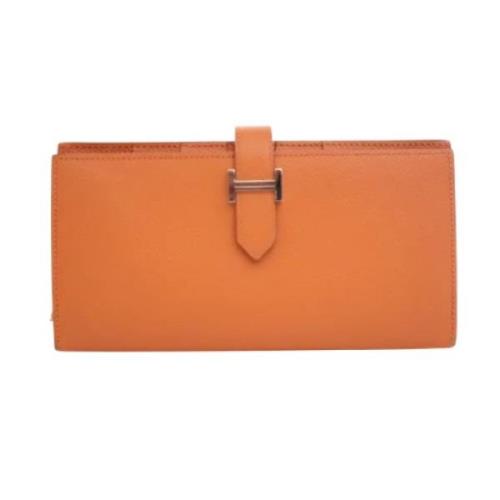 Pre-owned Leather wallets Hermès Vintage , Orange , Dames