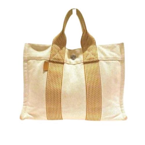 Pre-owned Canvas handbags Hermès Vintage , Beige , Dames