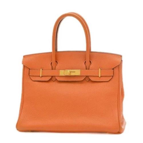 Pre-owned Leather handbags Hermès Vintage , Orange , Dames