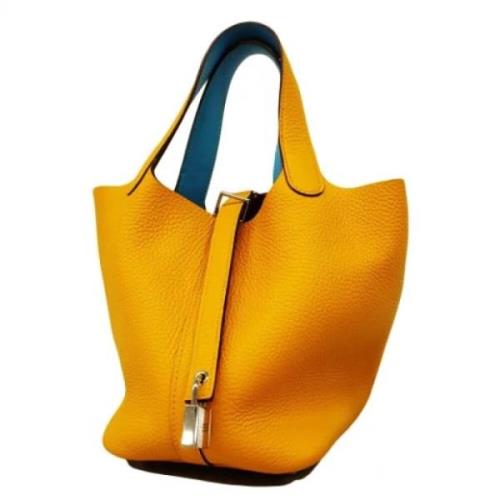 Pre-owned Leather handbags Hermès Vintage , Yellow , Dames